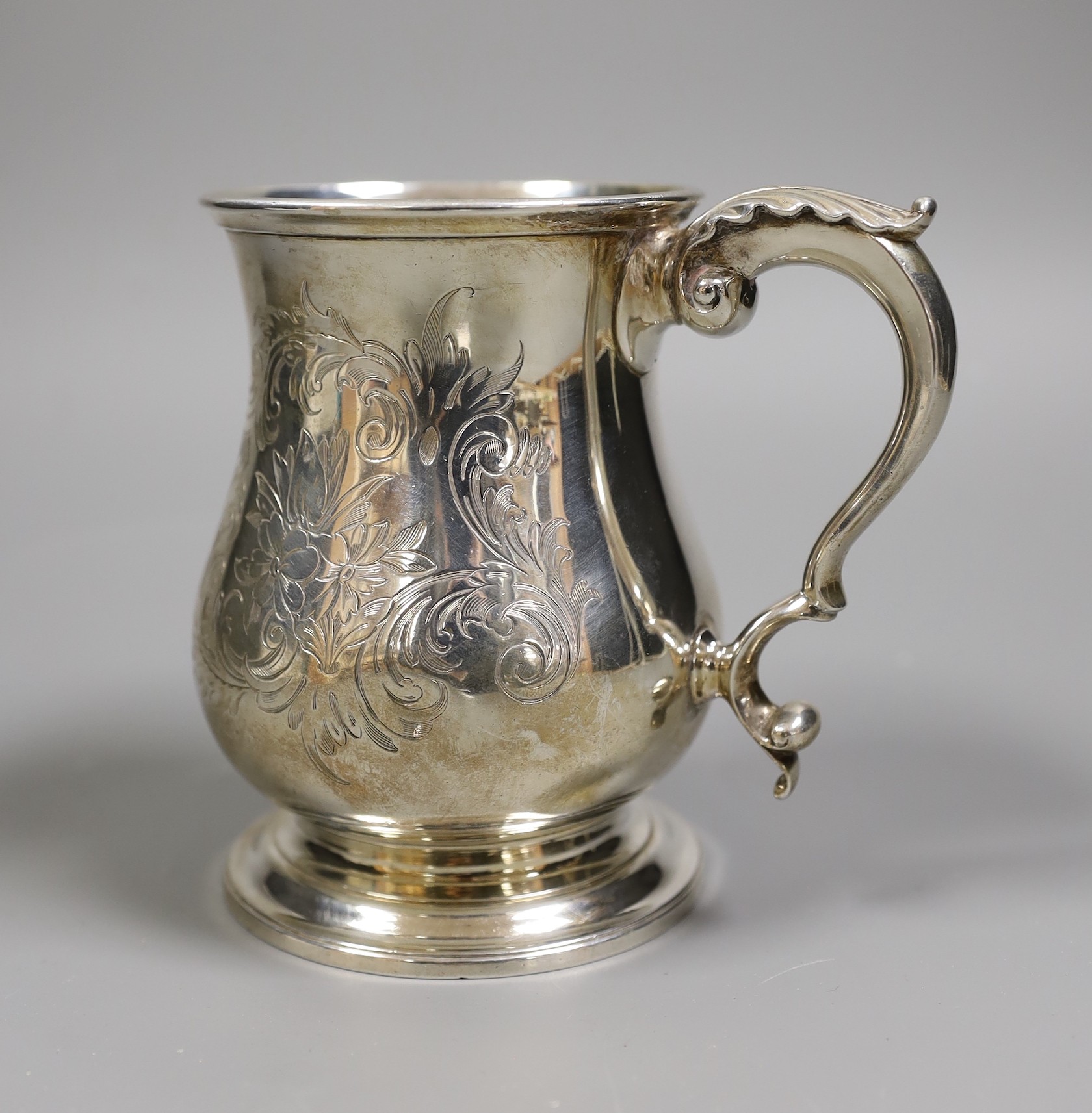 A Victorian foliate engraved silver baluster pint mug, Richards & Brown, London, 1860, height 12.7cm, 11.2oz.